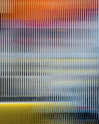An abstract image with vibrant vertical lines in orange, pink, blue, yellow, and black, creating a blurred, textured effect.