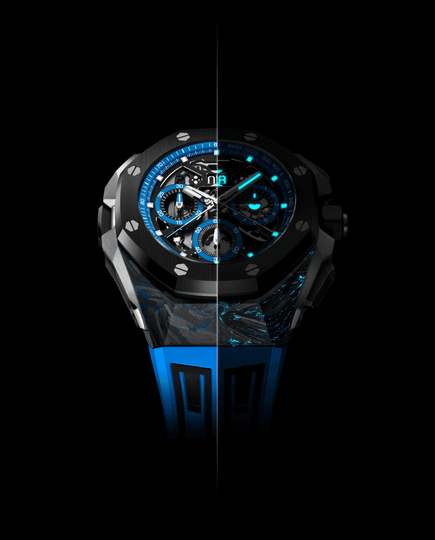 Black-and-blue luxury chronograph watch with luminous blue accents, blue strap, and a vertical split through the center on black background.