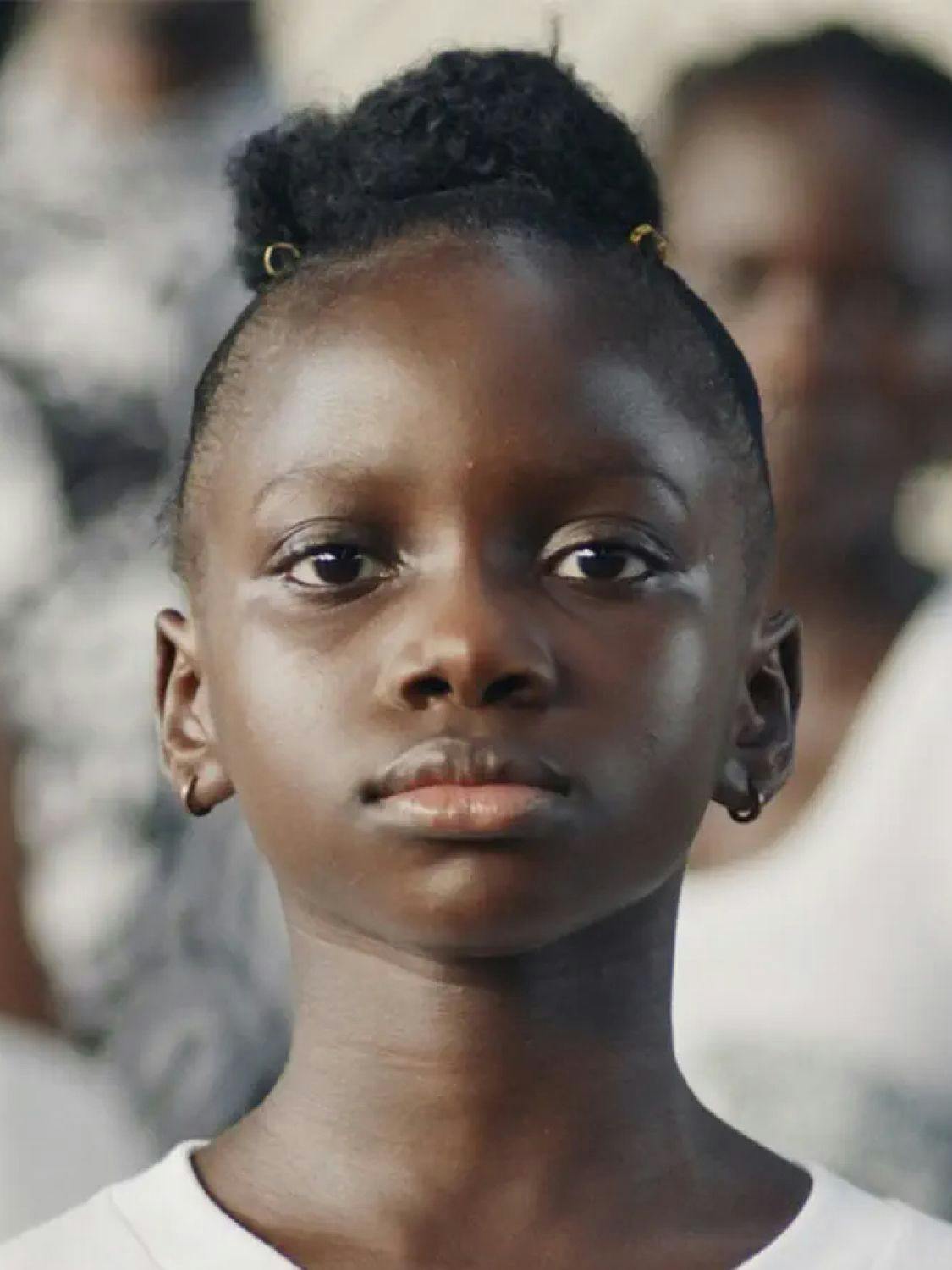 Determined African child facing looking us in the eyes