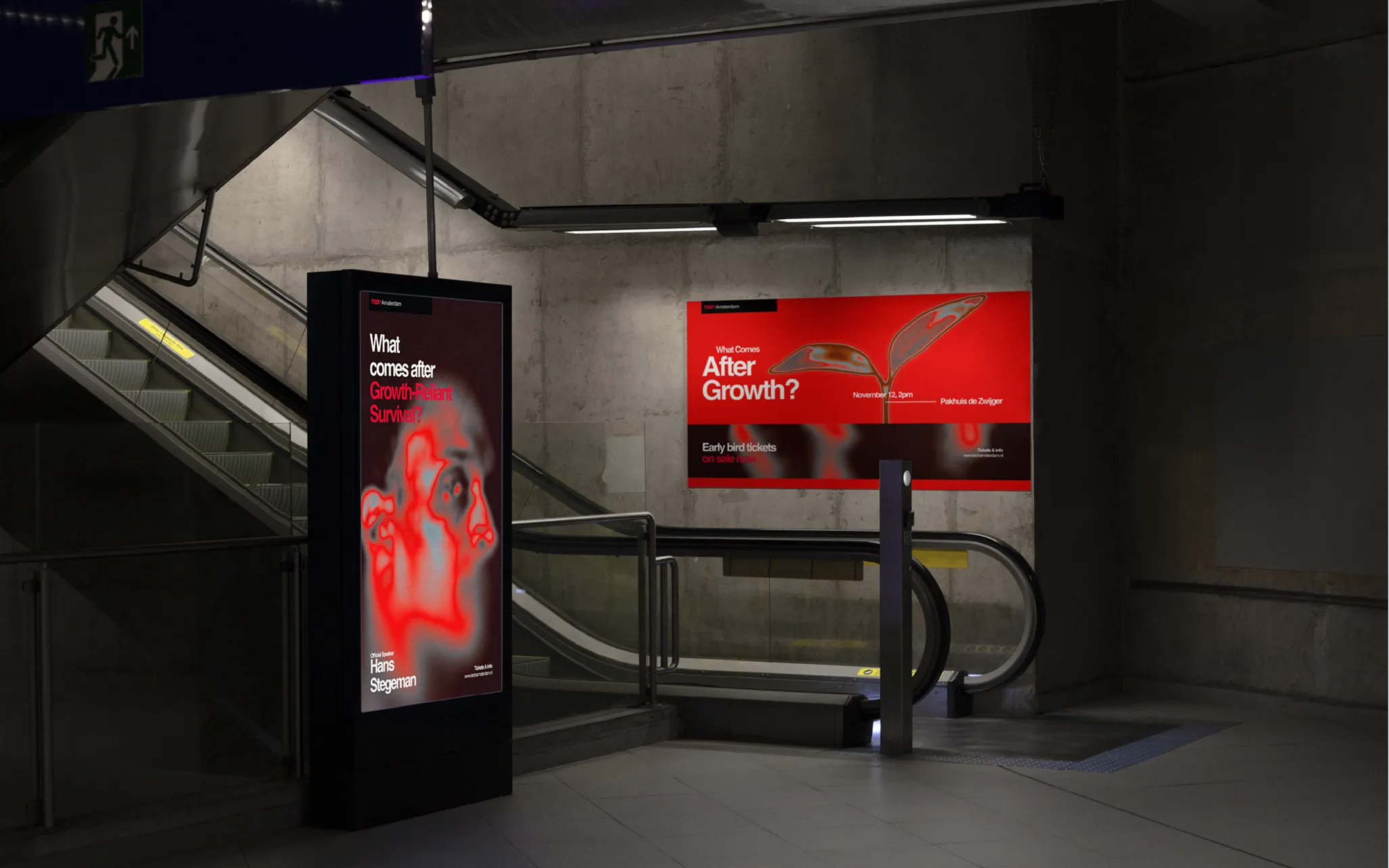 An underground station with escalators, featuring a red advertisement about growth and survival displayed on digital screens.