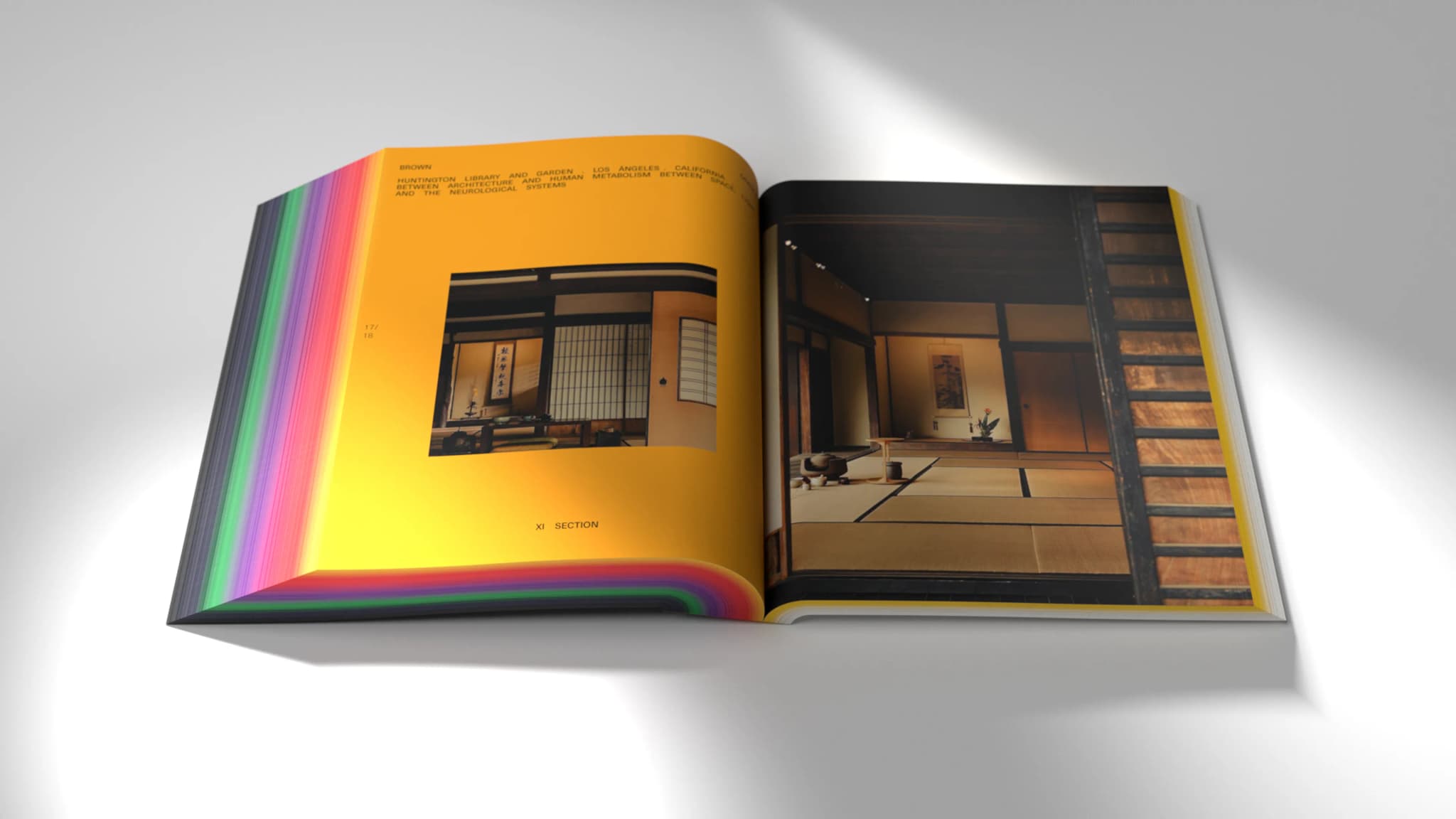 Open book with colorful edges, showing a picture of a traditional Japanese room with tatami mats and sliding doors on a yellow page.